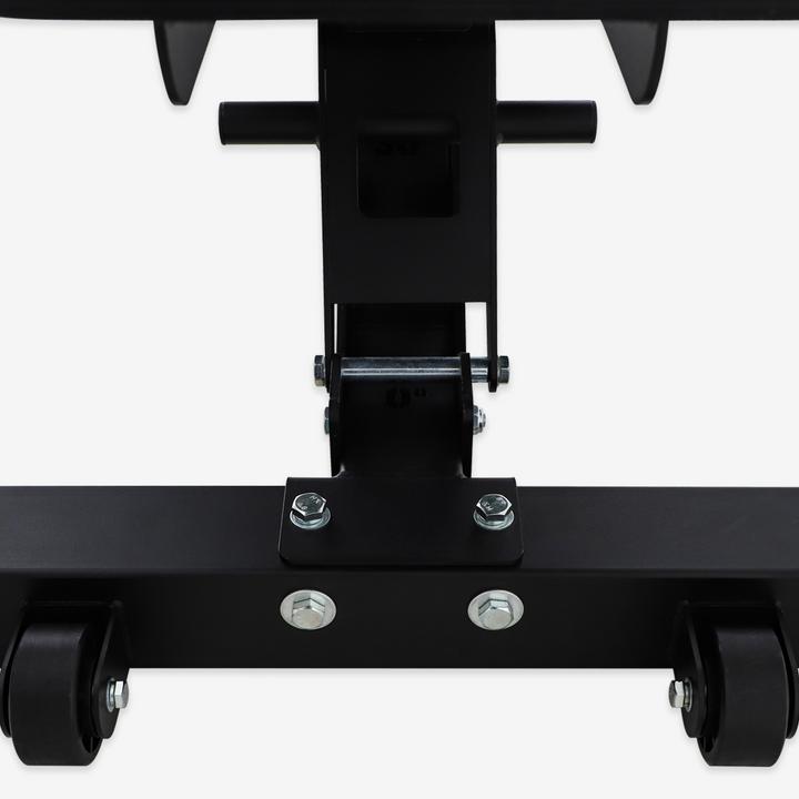Close-up of a black metal bracket with wheels on a white background