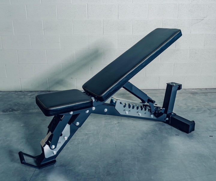 Adjustable heavy-duty bench for strength training workouts, suitable for barbell and dumbbell exercises.