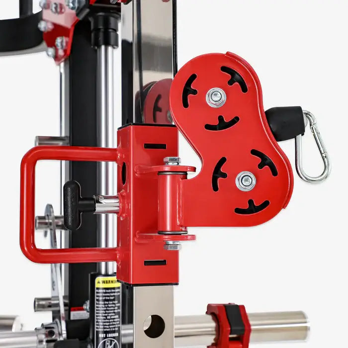 Close-up of the ALTAS AL-3058G strength machine's pulley system showcasing red handle and locking mechanism.