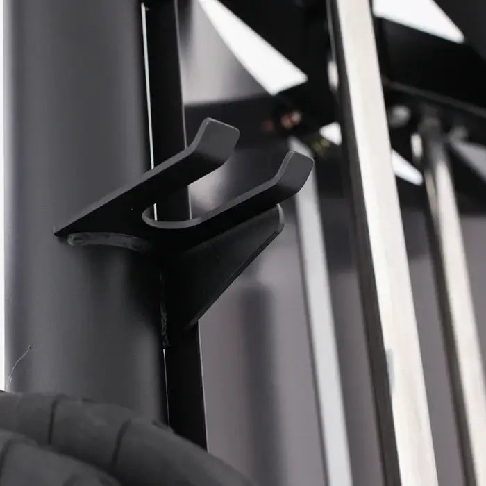 Close-up of the ALTAS AL-3107 Smith Machine accessory holder, ideal for organizing barbells and gym equipment.
