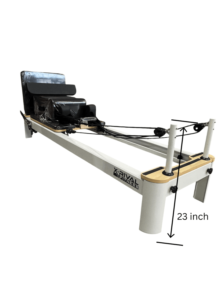 Compact Pilates Reformer S machine featuring adjustable resistance springs for home and studio use in Canada.