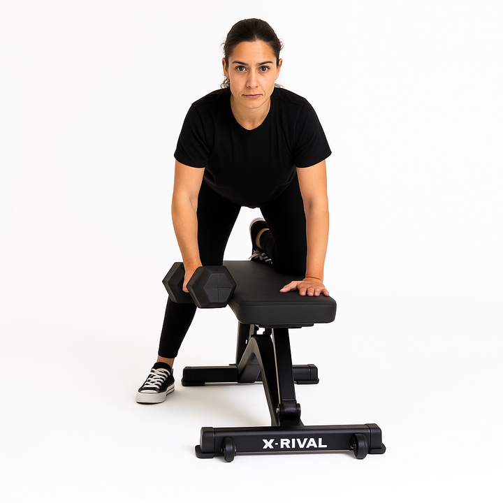Woman training with X-RIVAL Rubber Hex Dumbbell on adjustable bench, showcasing strength and fitness.